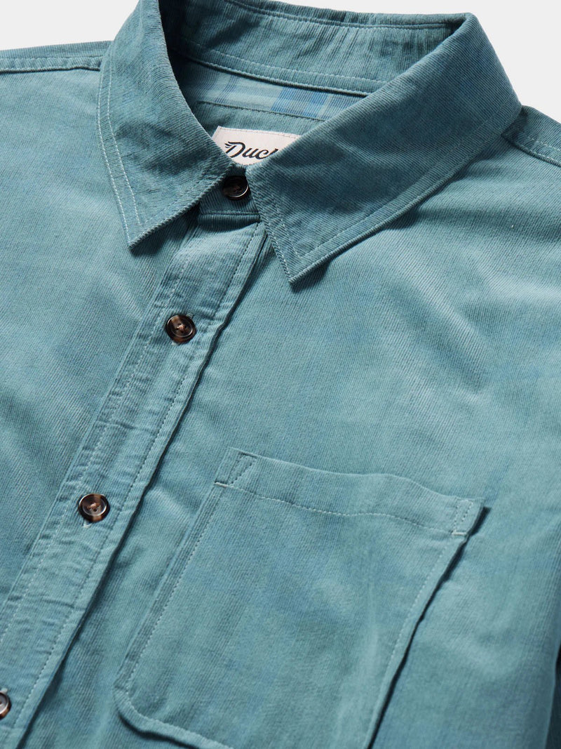 Load image into Gallery viewer, Close up view of the Duck Camp Corduroy shirt in the color Bering Sea. 
