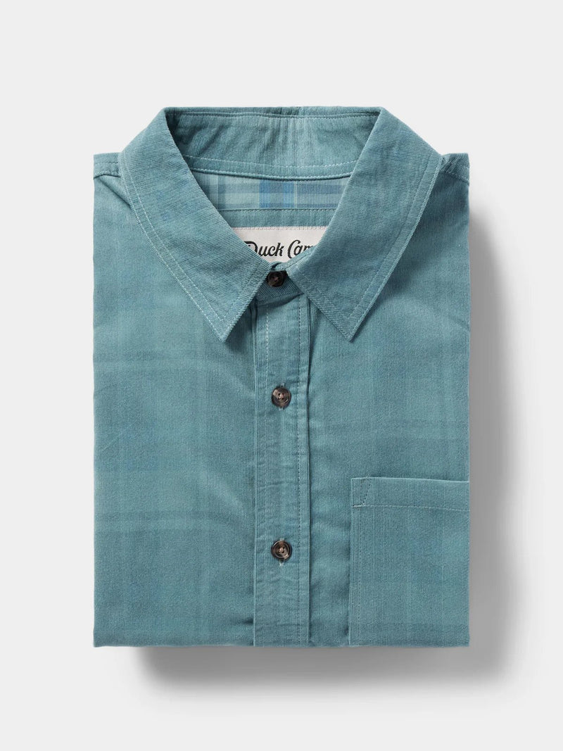 Load image into Gallery viewer, Folded view of the Duck Camp Corduroy Shirt in the color Bering Sea.
